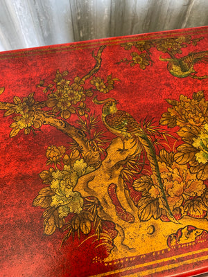 A red and gold lacquered chinoiserie cabinet