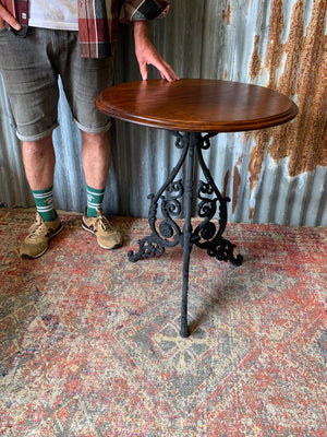 A black cast iron pub table