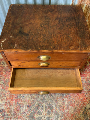 A pine chest of six drawers on castors
