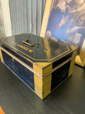 A Victorian black metal strong box with lock and key