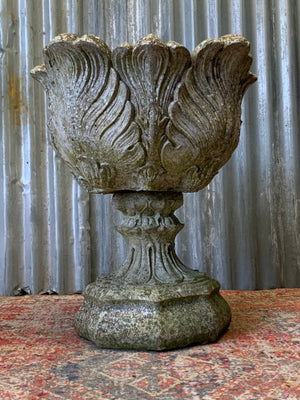 A pair of large acanthus cast stone urns