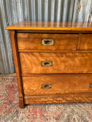 A satinwood chest of drawers