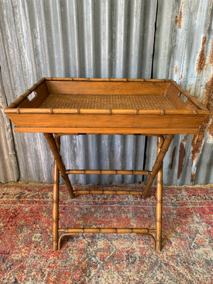 A faux bamboo butler's tray table