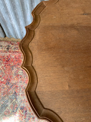 A Georgian style tilt top table with ball and claw feet