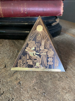 A group of four etched brass Egyptian revival pyramids