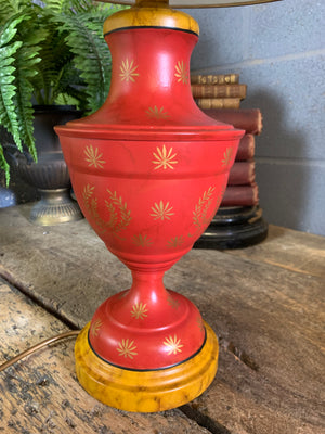 A pair of red and black toleware lamps