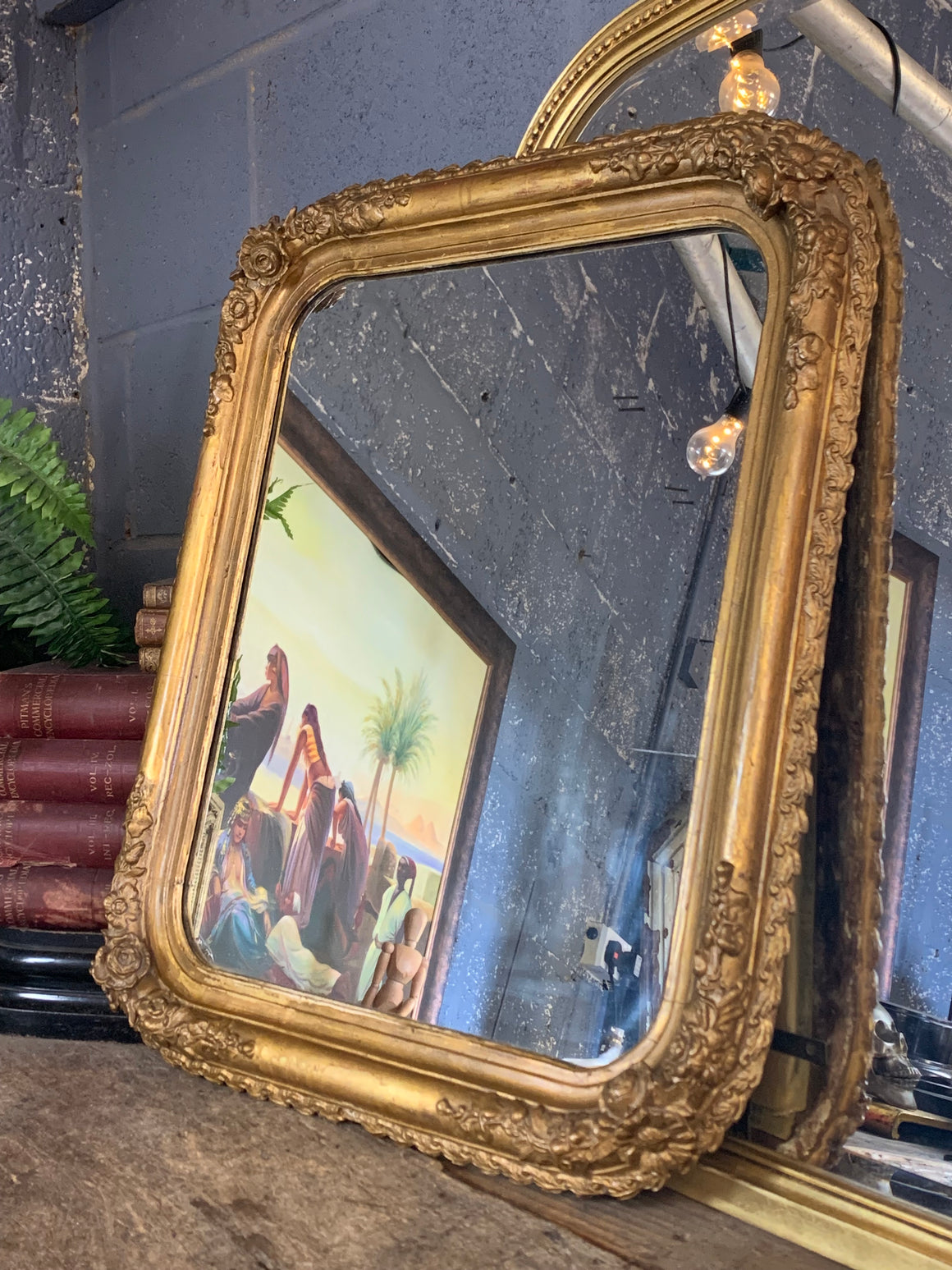 A giltwood mirror with floral detailing