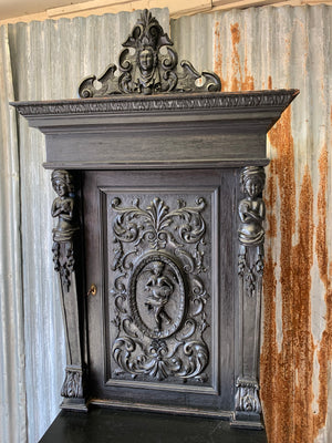 A heavily carved ebonised oak Gothic dresser