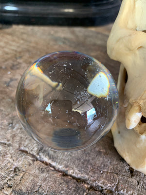 A Victorian crystal ball with box and stand