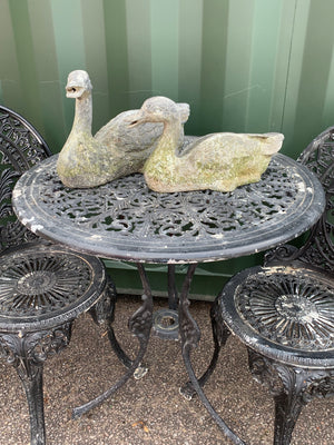 A pair of garden duck figures