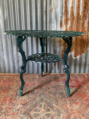 A green garden table and chairs set
