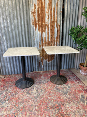 A cast iron garden table with heavy marble top ~ B
