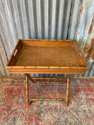 A faux bamboo butler's tray table