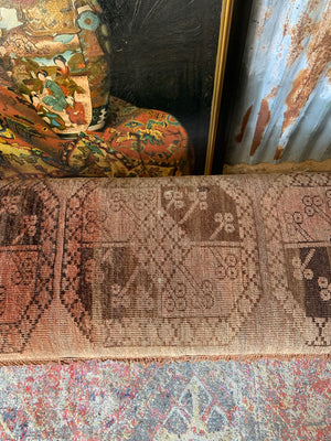 A large Persian carpet footstool