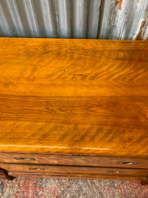 A satinwood chest of drawers