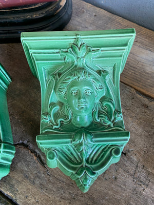 A pair of neoclassical ceramic wall pockets