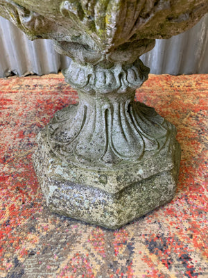 A pair of large acanthus cast stone urns