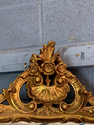 A large giltwood Rococo style mirror