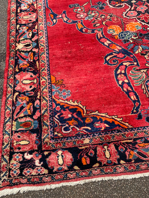 A very large rectangular red ground Persian floral rug ~ 12ft x 8ft