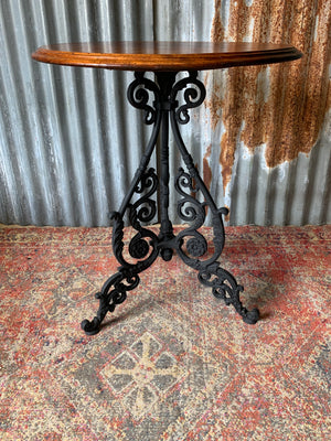 A black cast iron pub table