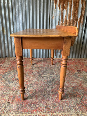 A pine two-drawer desk