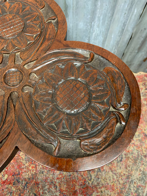 A carved mahogany occasional table with trefoil cloverleaf top