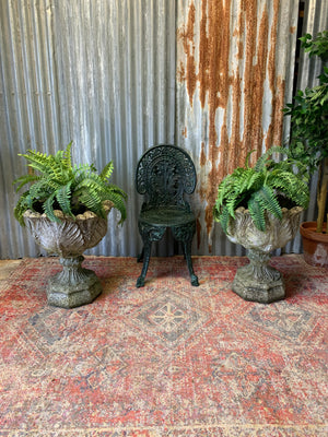 A pair of large acanthus cast stone urns