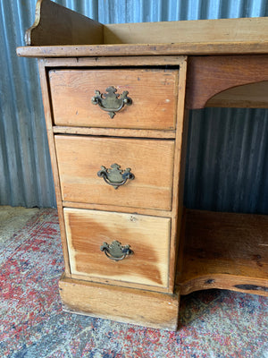 A pine clerk's desk with galleried top