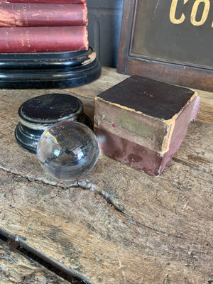 A Victorian crystal ball with box and stand