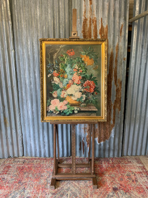 A floor standing and foldable wooden artist's easel