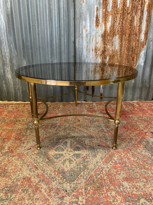 A rare circular brass and glass Hollywood Regency coffee table