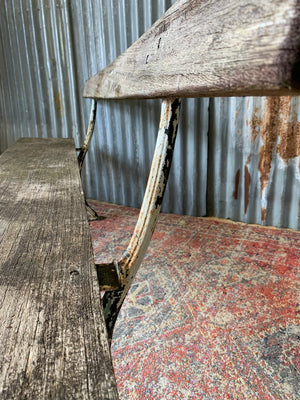 A cast iron and wooden garden bench