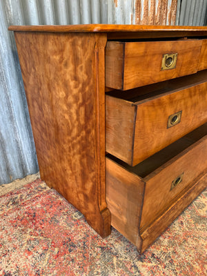 A satinwood chest of drawers