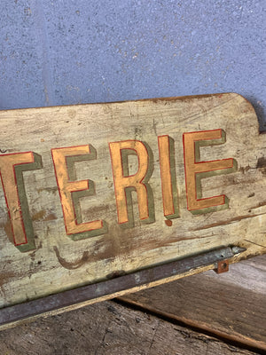 A French ‘charcuterie’ sign with hanging rack