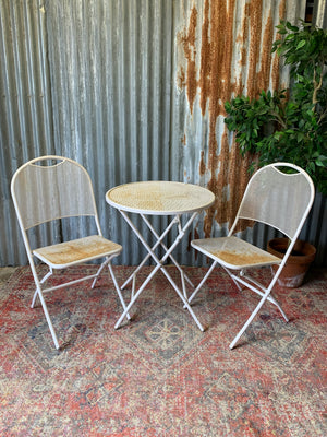 A mid-Century style mesh garden set - table and two chairs