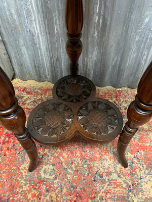 A carved mahogany occasional table with trefoil cloverleaf top