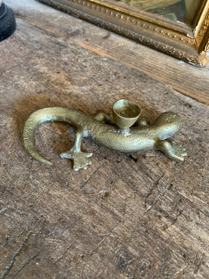 A pair of brass candlesticks in the form of lizards