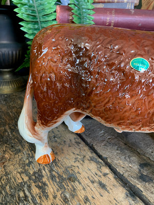 A large ceramic Hereford bull by Nelson Pottery