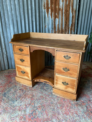 A pine clerk's desk with galleried top
