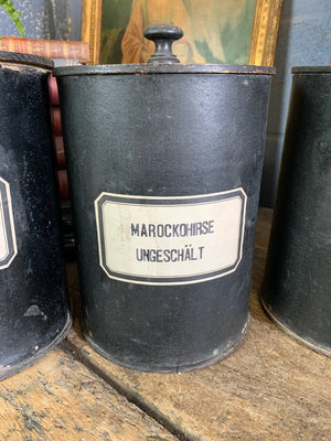 A set of three lidded wooden apothecary jars