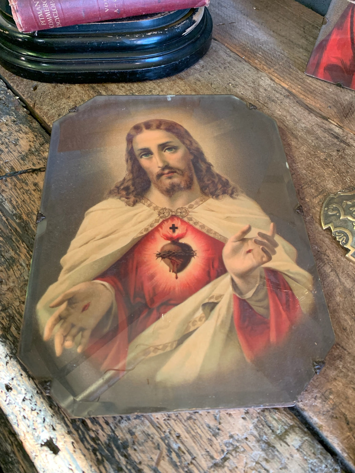 An early-20th Century framed print of the Jesus Christ Sacred Heart depiction