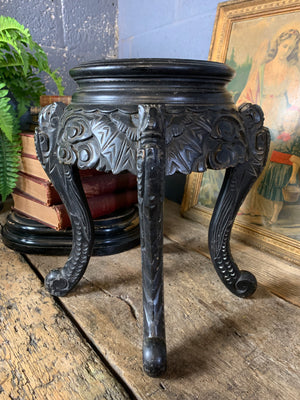 A small Chinese ebonised pedestal stand