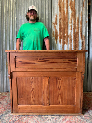 A pine double lectern standing desk