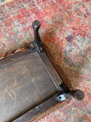 A large Persian carpet footstool