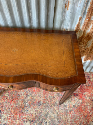 A serpentine desk and leather chair by Bevan Funnell