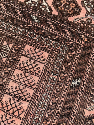 A Persian brown ground rectangular rug- 243cm x 166cm