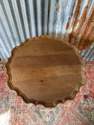 A Georgian style tilt top table with ball and claw feet