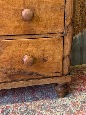 A pine chest of two over two drawers