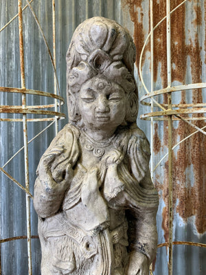 A cast stone garden statue of Guanyin