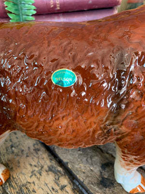 A large ceramic Hereford bull by Nelson Pottery